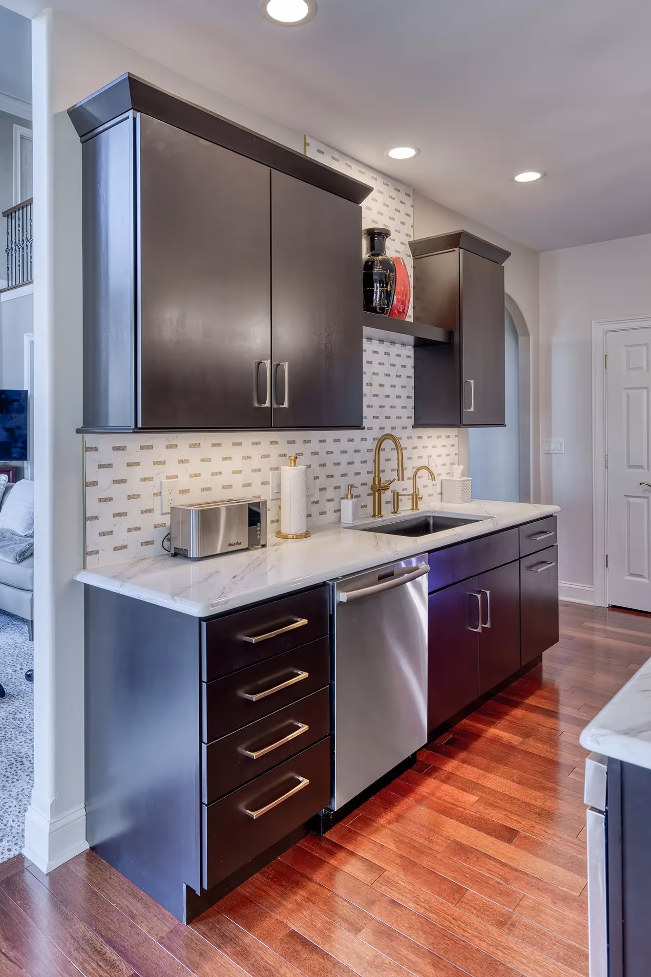 Spacious kitchen with dark cabinets