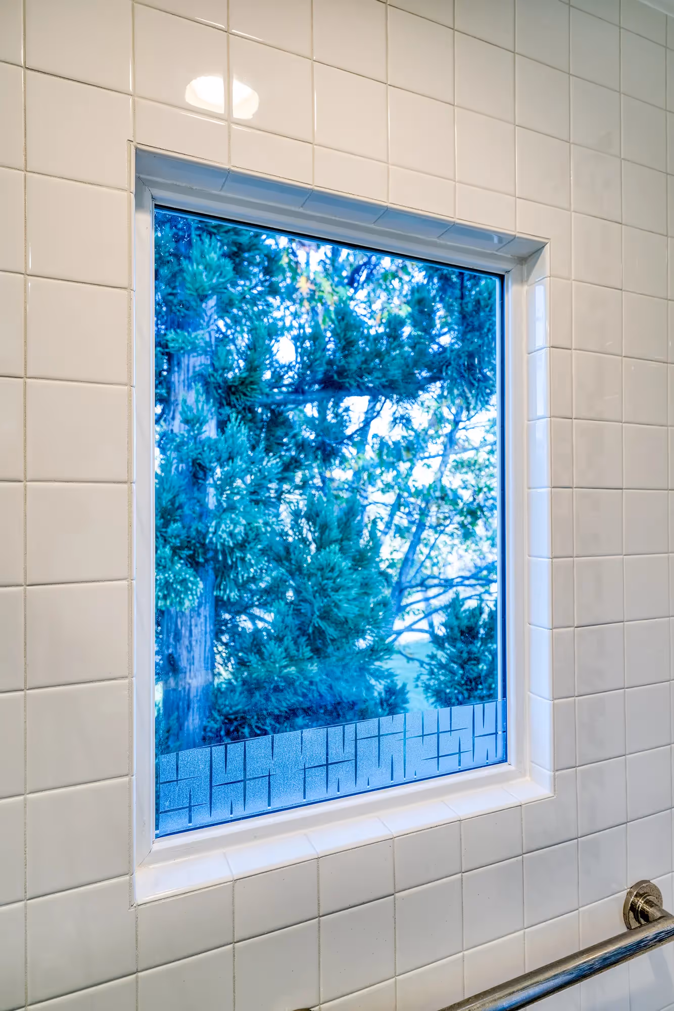 Bathroom with natural light and simple white tiles