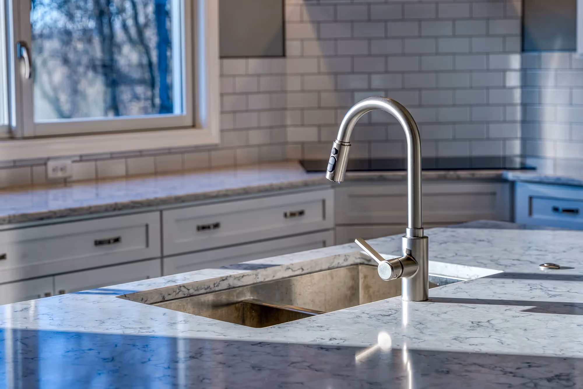 Another angle of the kitchen showing more cabinets