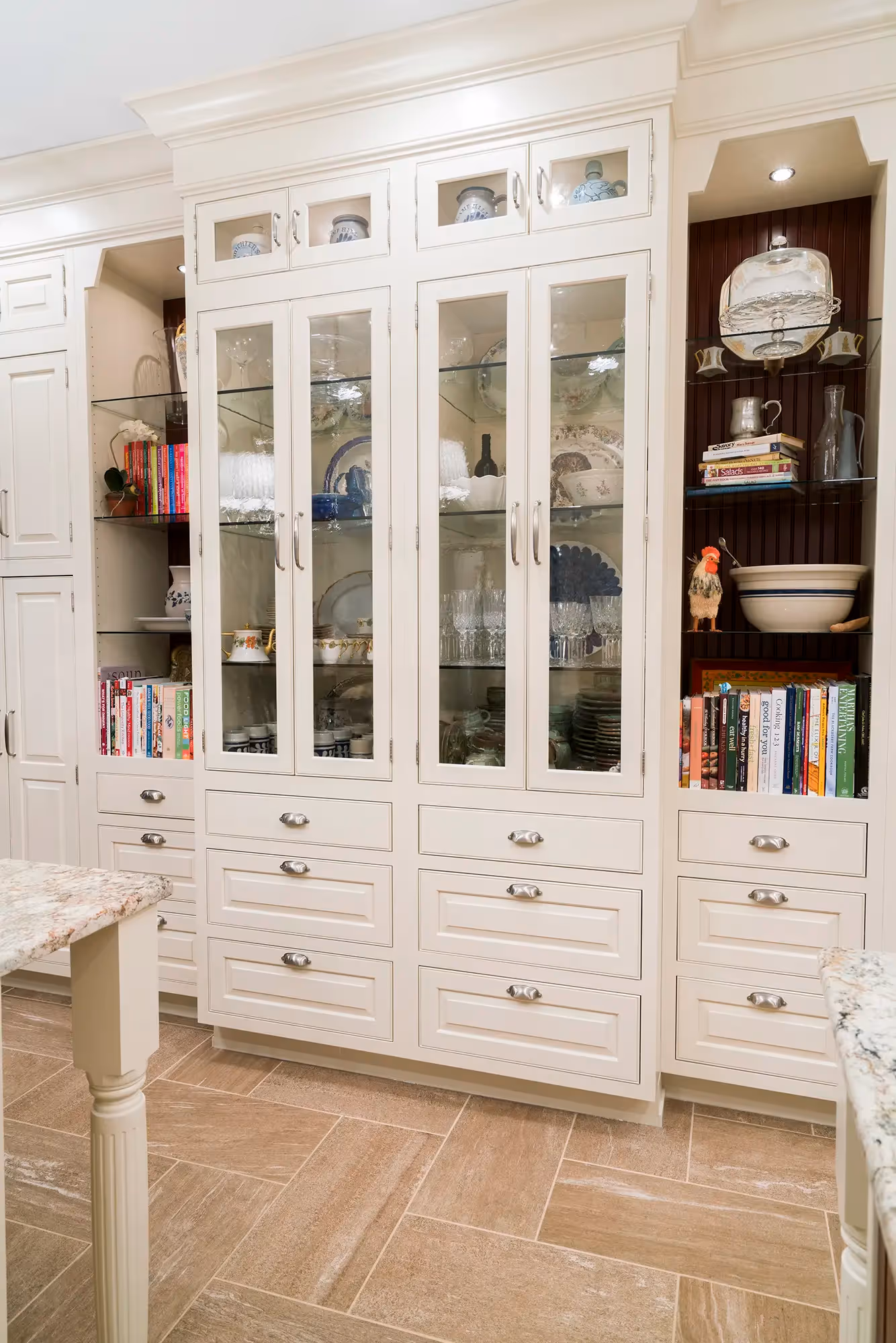 White pantry cabinets with glass shelves