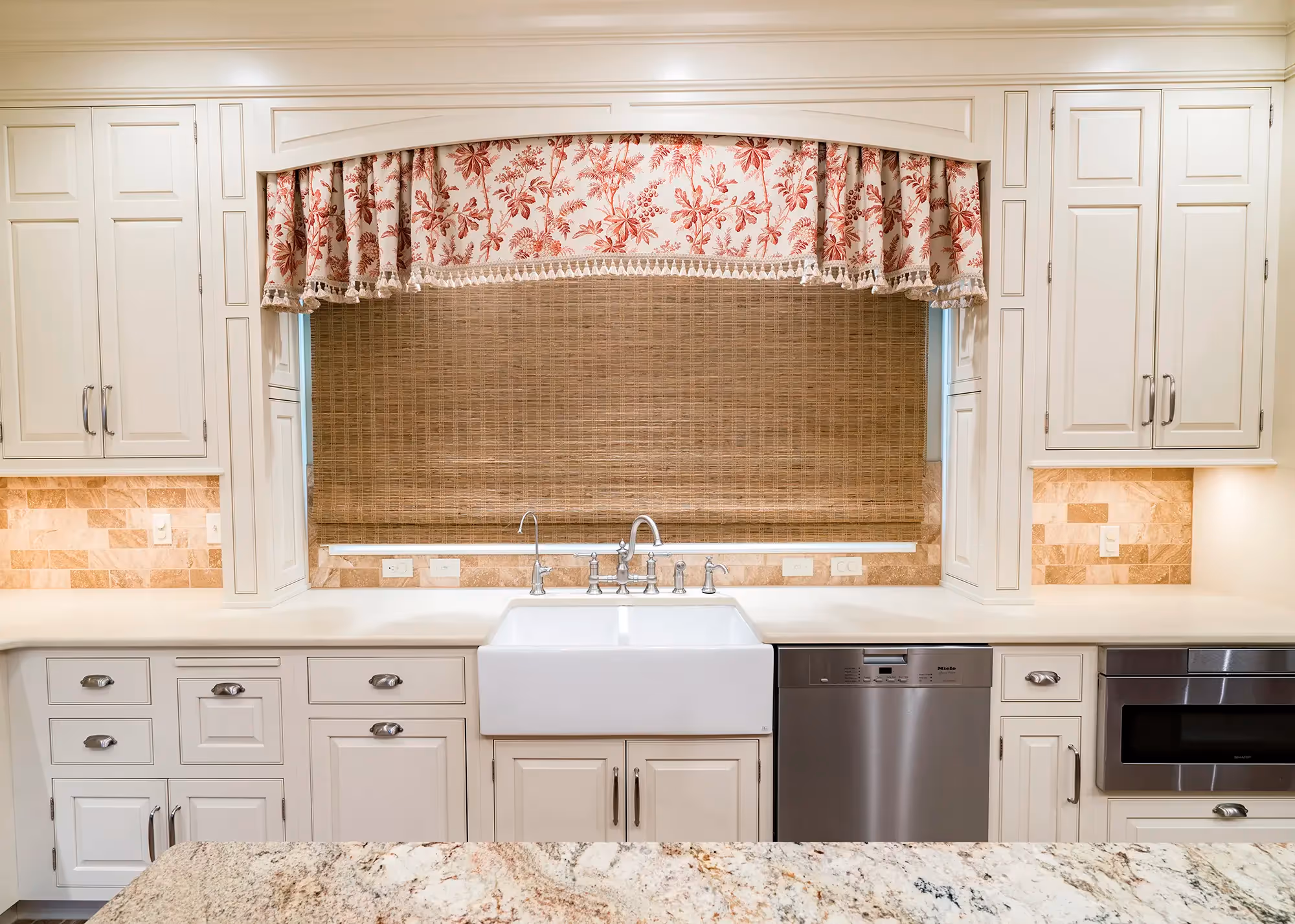 View of kitchen with counter and barstool