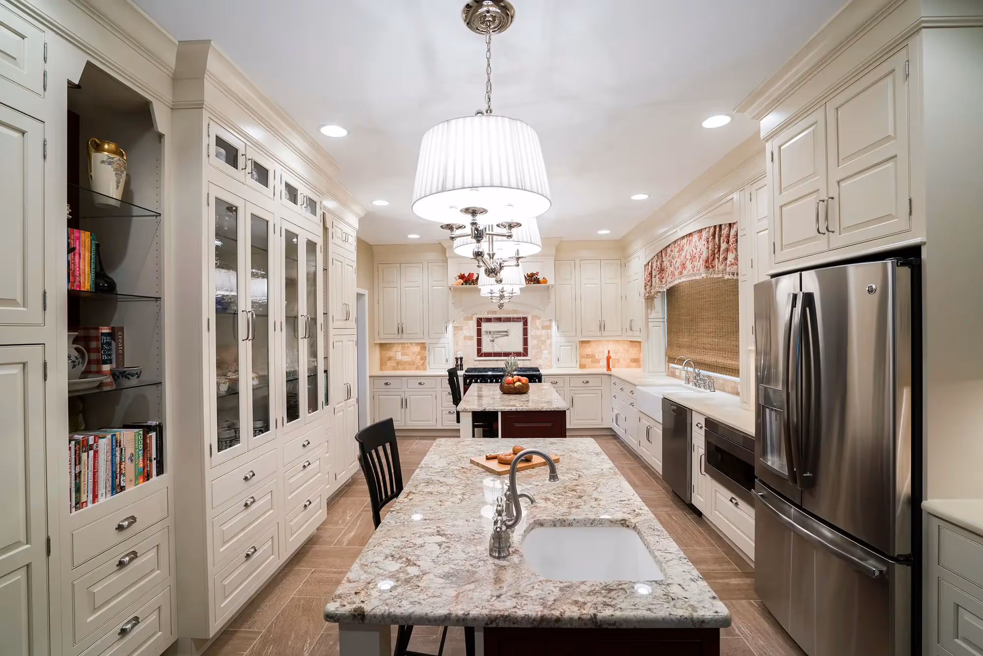 Kitchen sink area with window and cabinetry