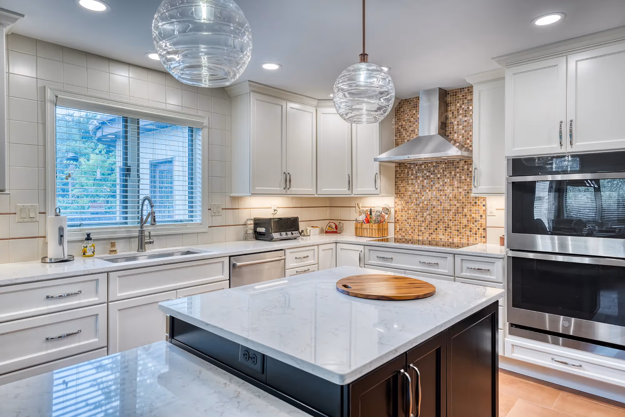 Modern kitchen island with white countertops