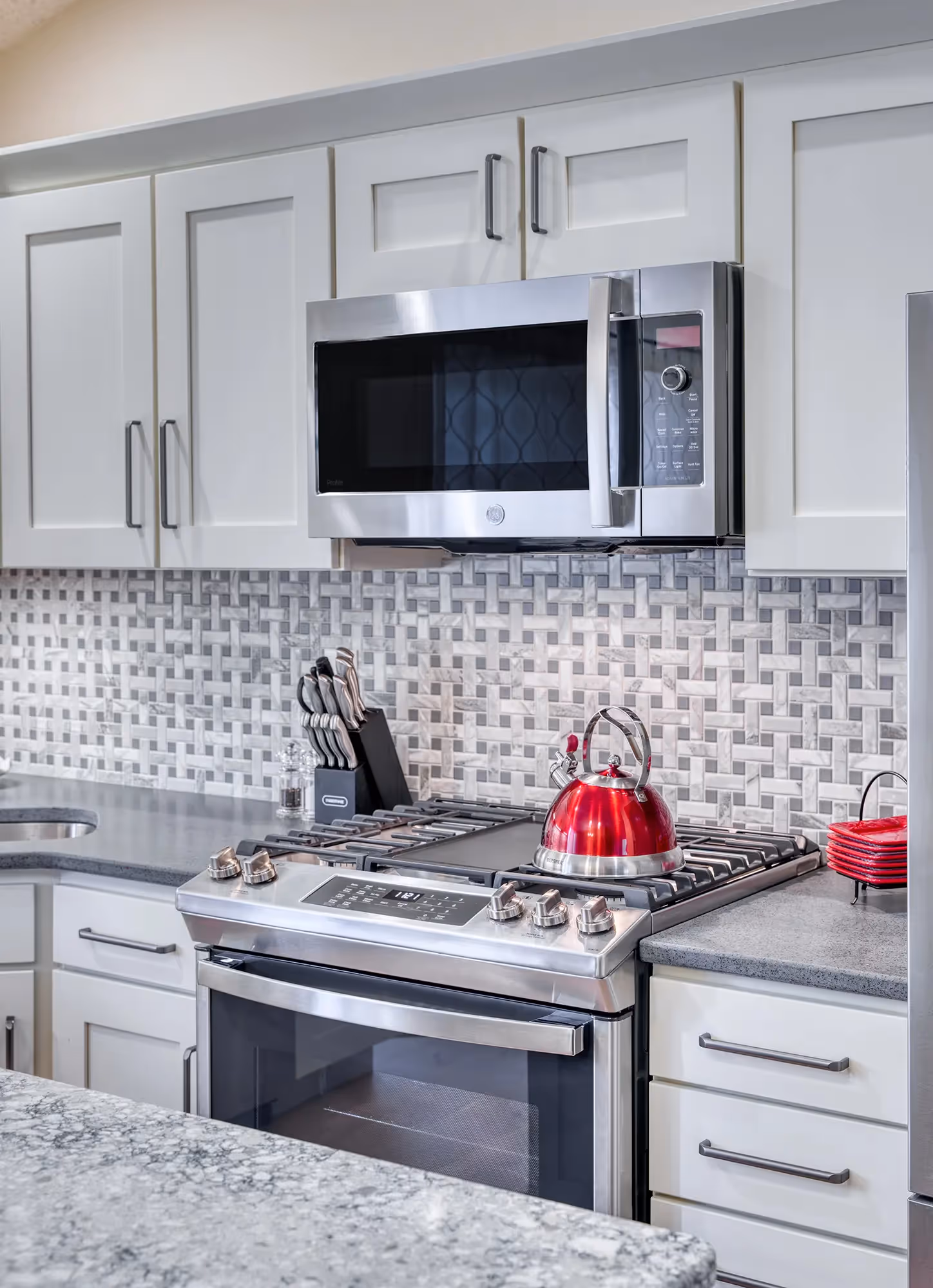 Corner of a modern kitchen with black stools