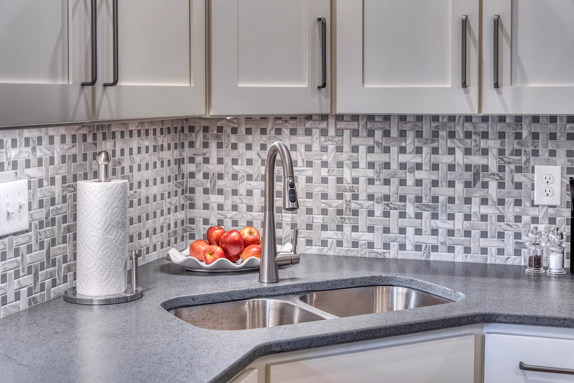 Microwave above stove with red kitchen accessories