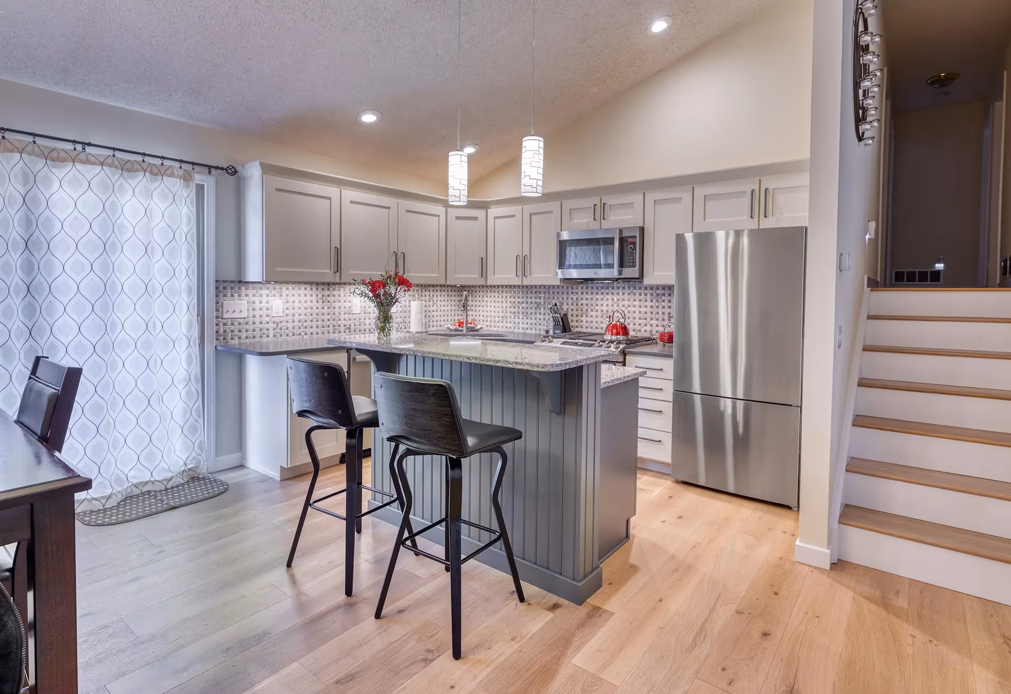 Dining table with view of kitchen