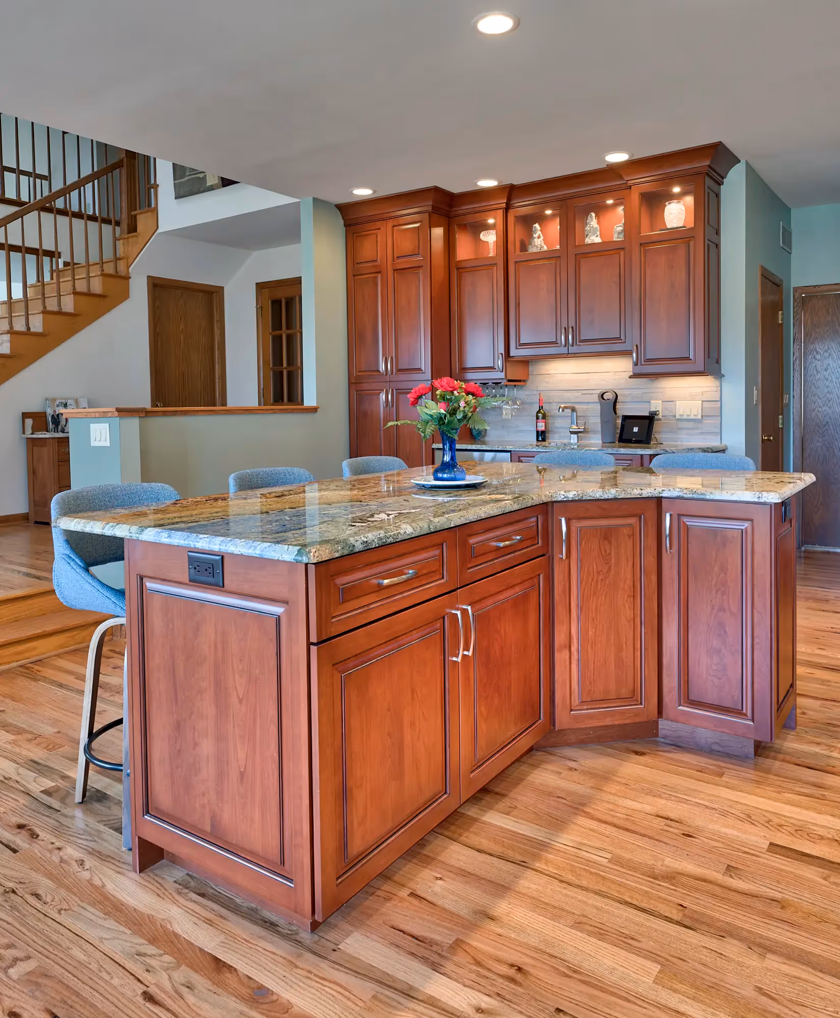 Transitional-style kitchen featuring a mix of rich, warm wood cabinetry