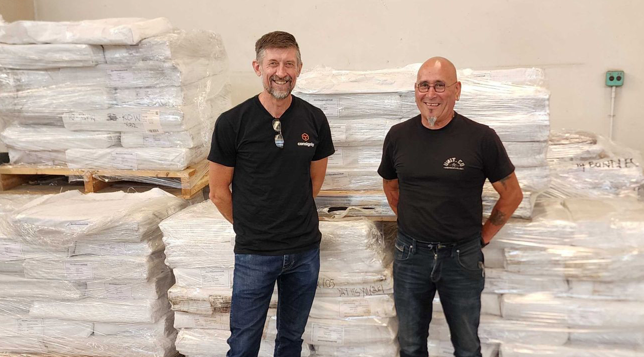 High angle photo of the team walking thorough a warehouse