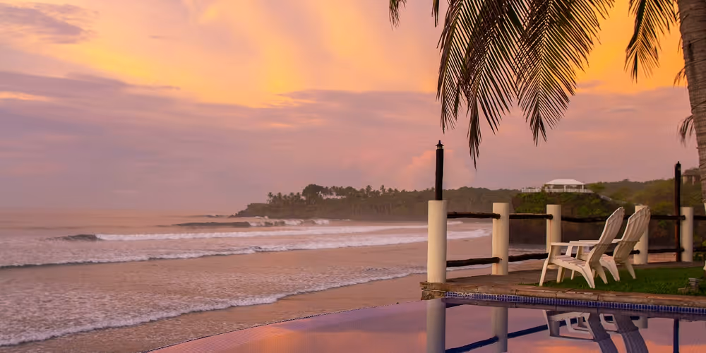 A photo of the sunset by the beach in El Salvador