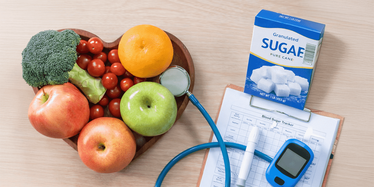 Heart-shaped bowl of fruits with sugar cubes, glucose meter, and medical tools representing the relationship between sugar consumption and diabetes risk