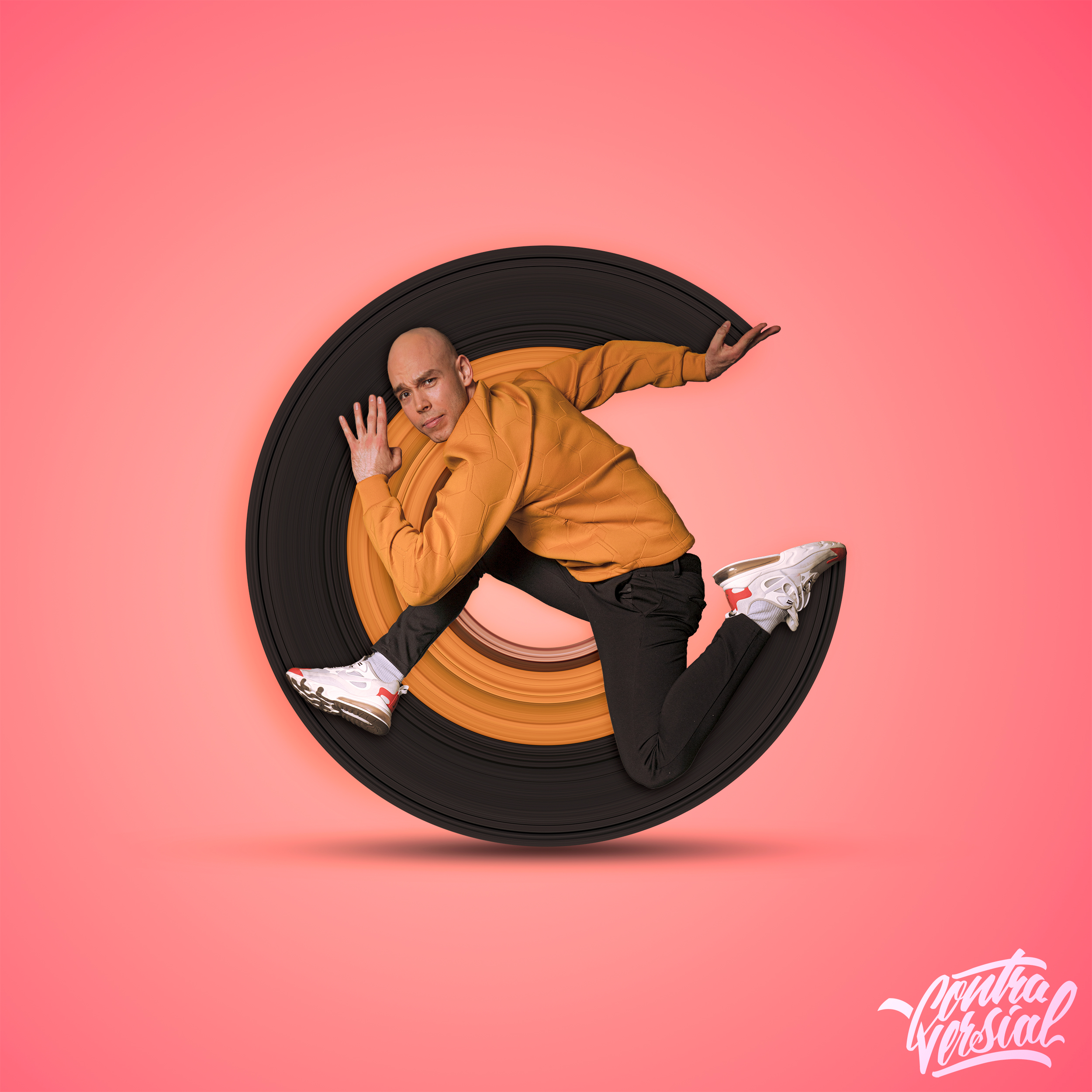 Man in an orange jacket and black pants jumping inside a stylized circular swirl on a pink background.