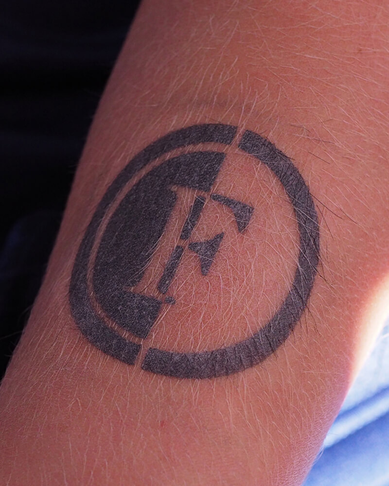 Foto van airbrush tattoo Feyenoord logo.