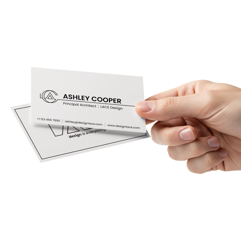 A hand holding LACE business cards