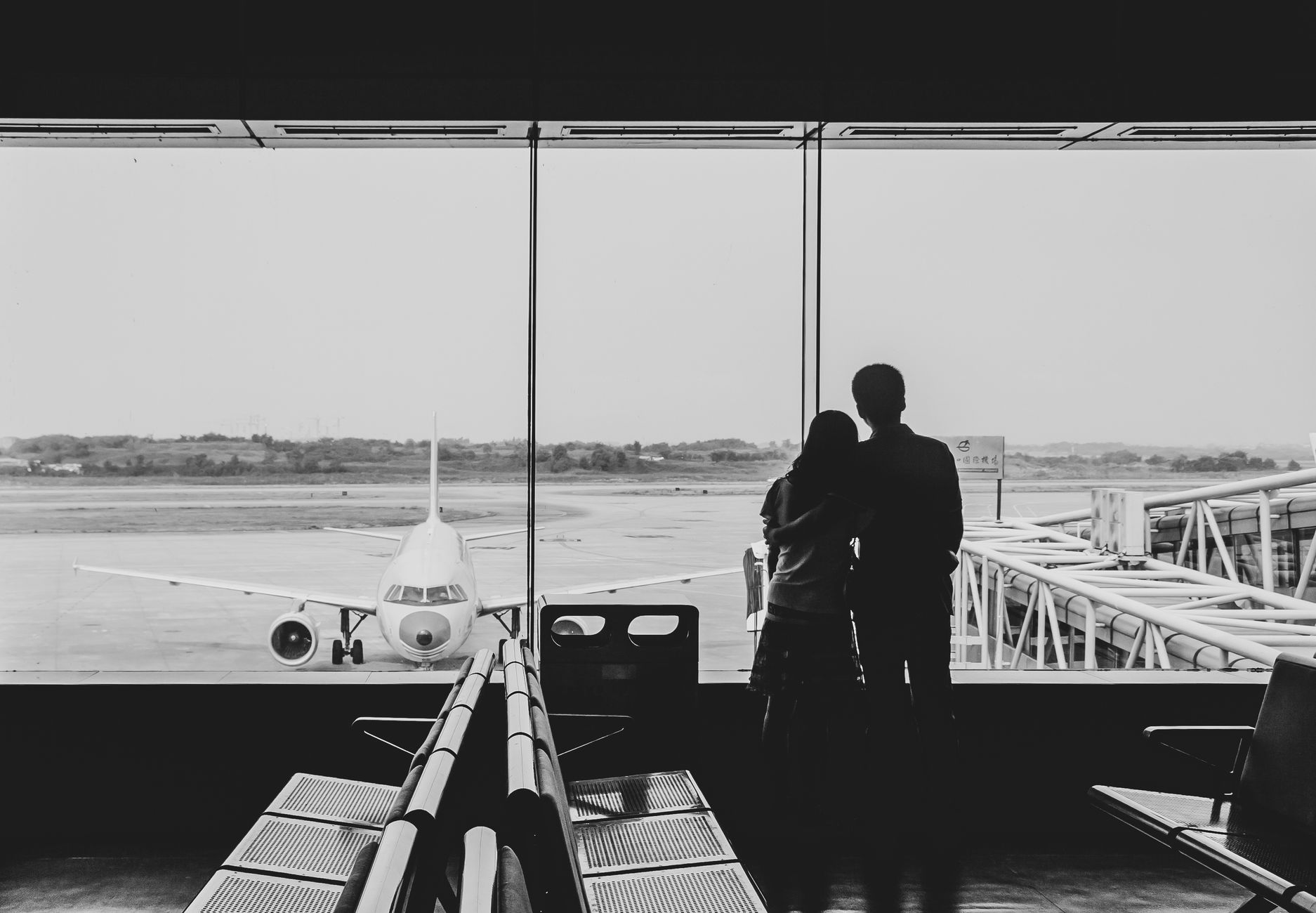 couple separated airport long distance relationship