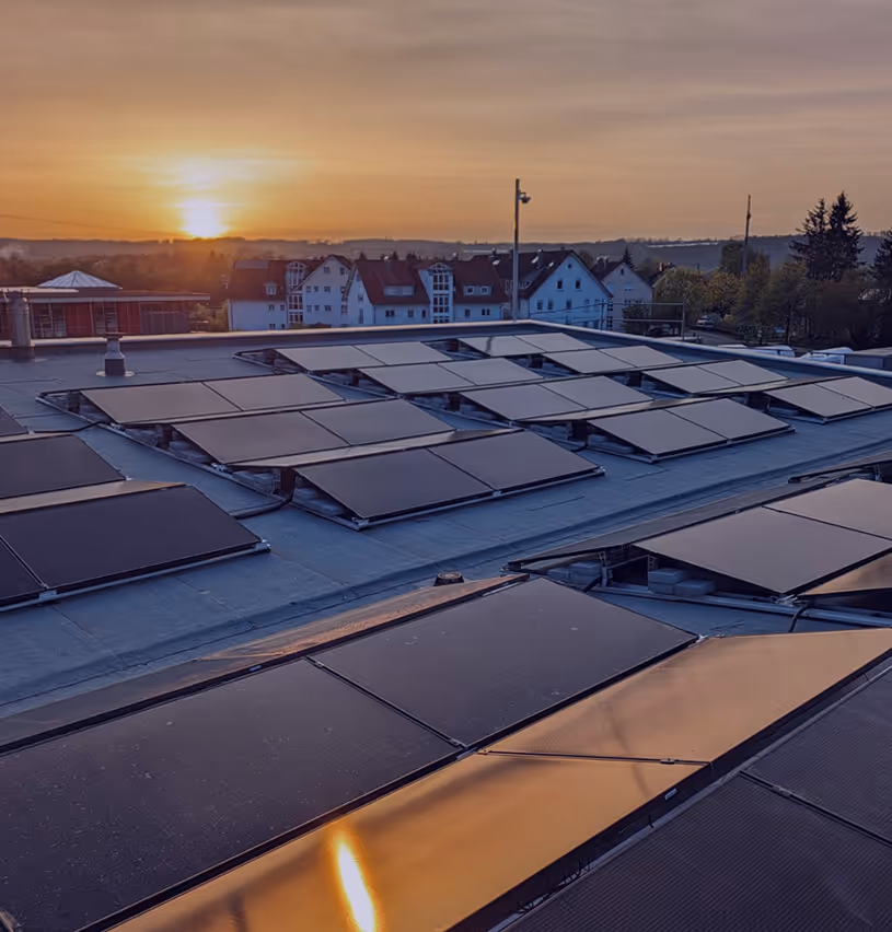 sunset at the roof top full of solar panels