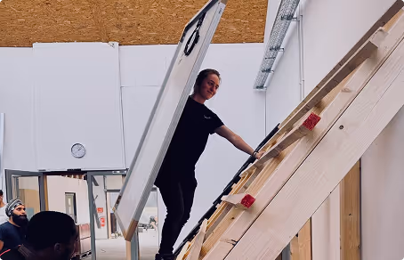 women climbing on ladder