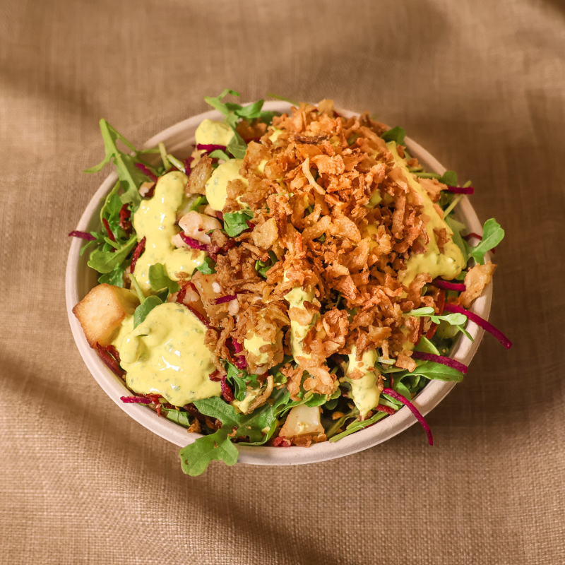 Beets and blues salad bowl with rocket, rice, beetroot, pear, feta, blue cheese, pickled oni