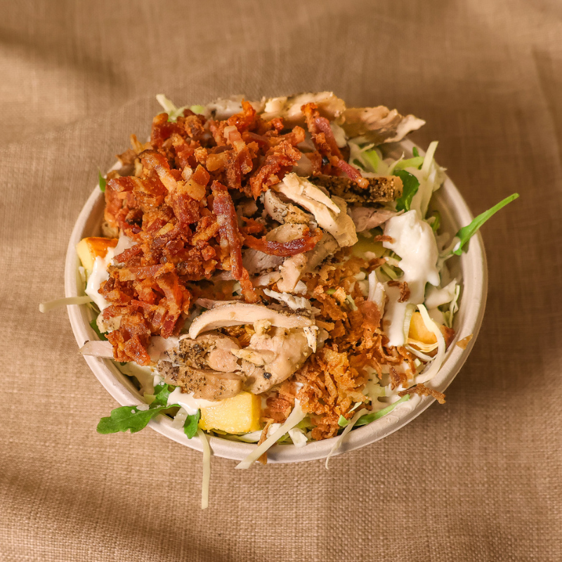 Herbalist salad bowl with savoy cabbage, squash, rice, carrot, feta