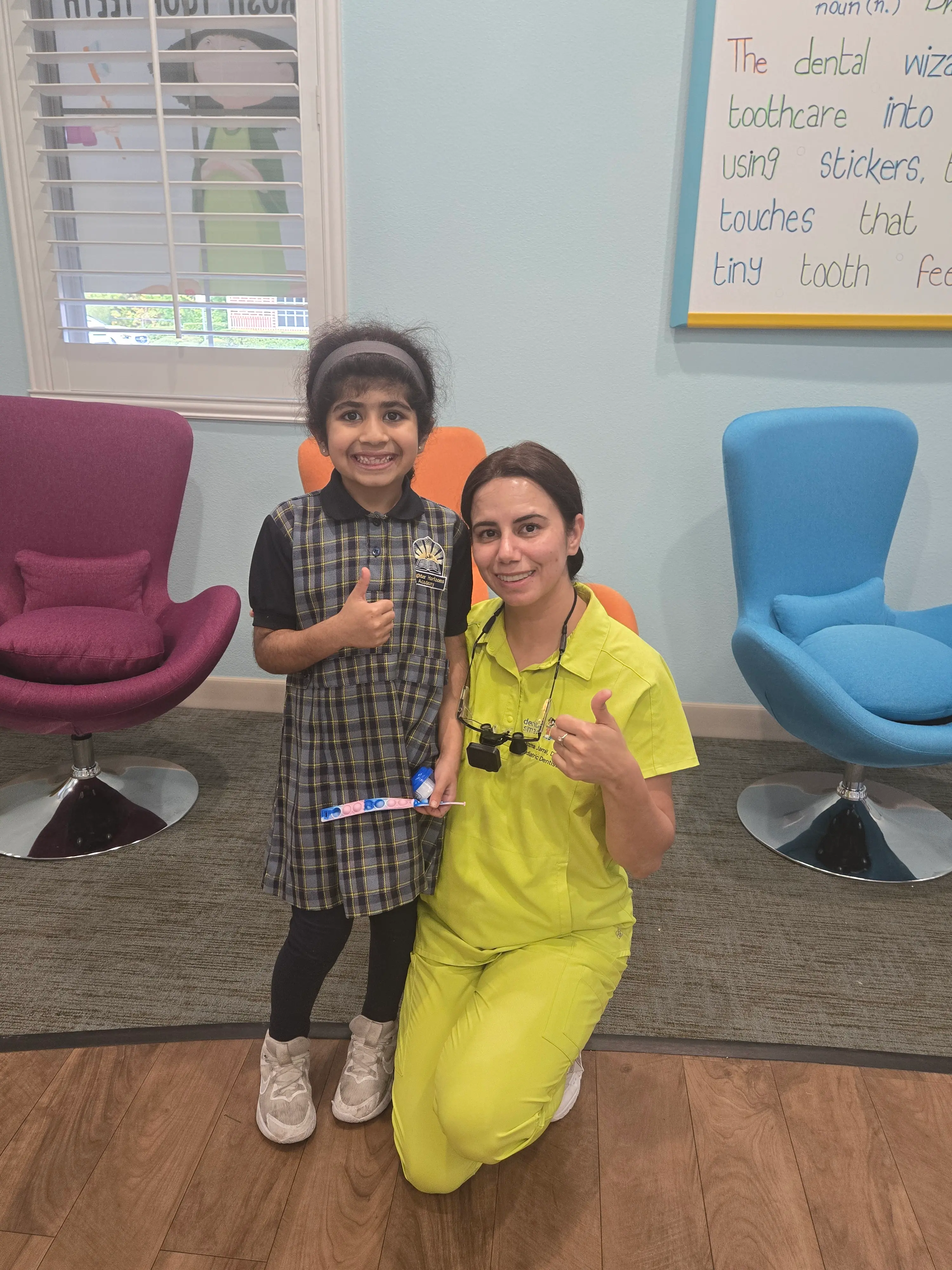 a diverse, modern nurse smiling warmly as they comfort a child patient