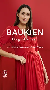 Woman in a red dress posing against a red background with Baukjen brand and UN Global Climate Action Award Winner text.