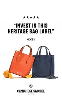 Orange and navy Cambridge Satchel bags with oranges and blueberries, featuring a Vogue quote praising the heritage bag label.
