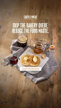 Coffee, honey, jam, and crackers with butter and spread on a cloth napkin on a wooden table, promoting skipping bakery queues to reduce food waste.