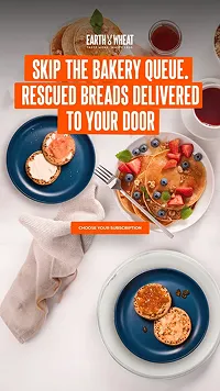 Top view of plates with bagels and fruit next to teas with text promoting rescued breads delivered to your door and a call to subscribe.