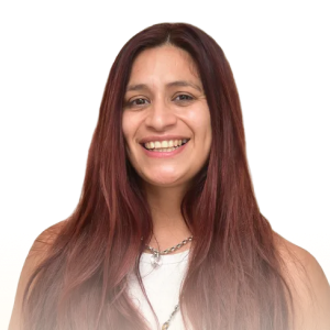 Smiling young woman with long straight brown hair wearing a white top and silver necklace.