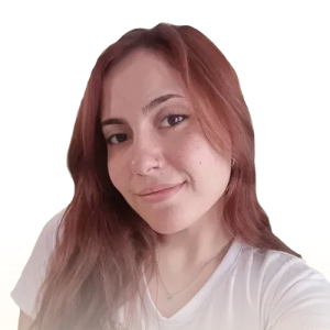 Young woman with long reddish hair wearing a white top smiling softly against a transparent background.