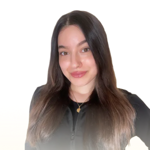 Young woman with long straight dark hair smiling, wearing a black zip-up top and a gold necklace.