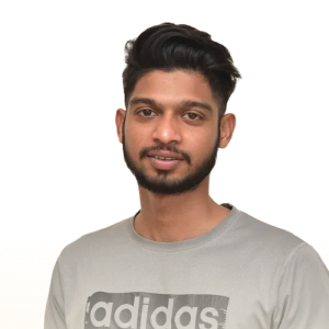 Young man with short black hair and beard wearing a light gray Adidas t-shirt.