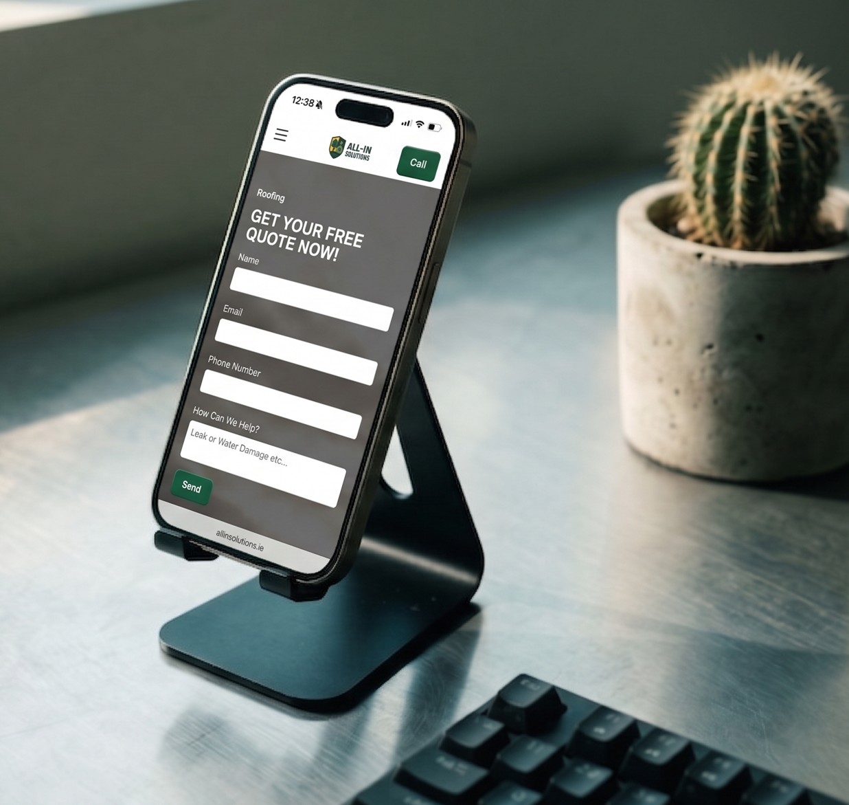 Smartphone on a black stand displaying a roofing service form titled 'Get Your Free Quote Now!' with fields for name, email, phone number, and service details.