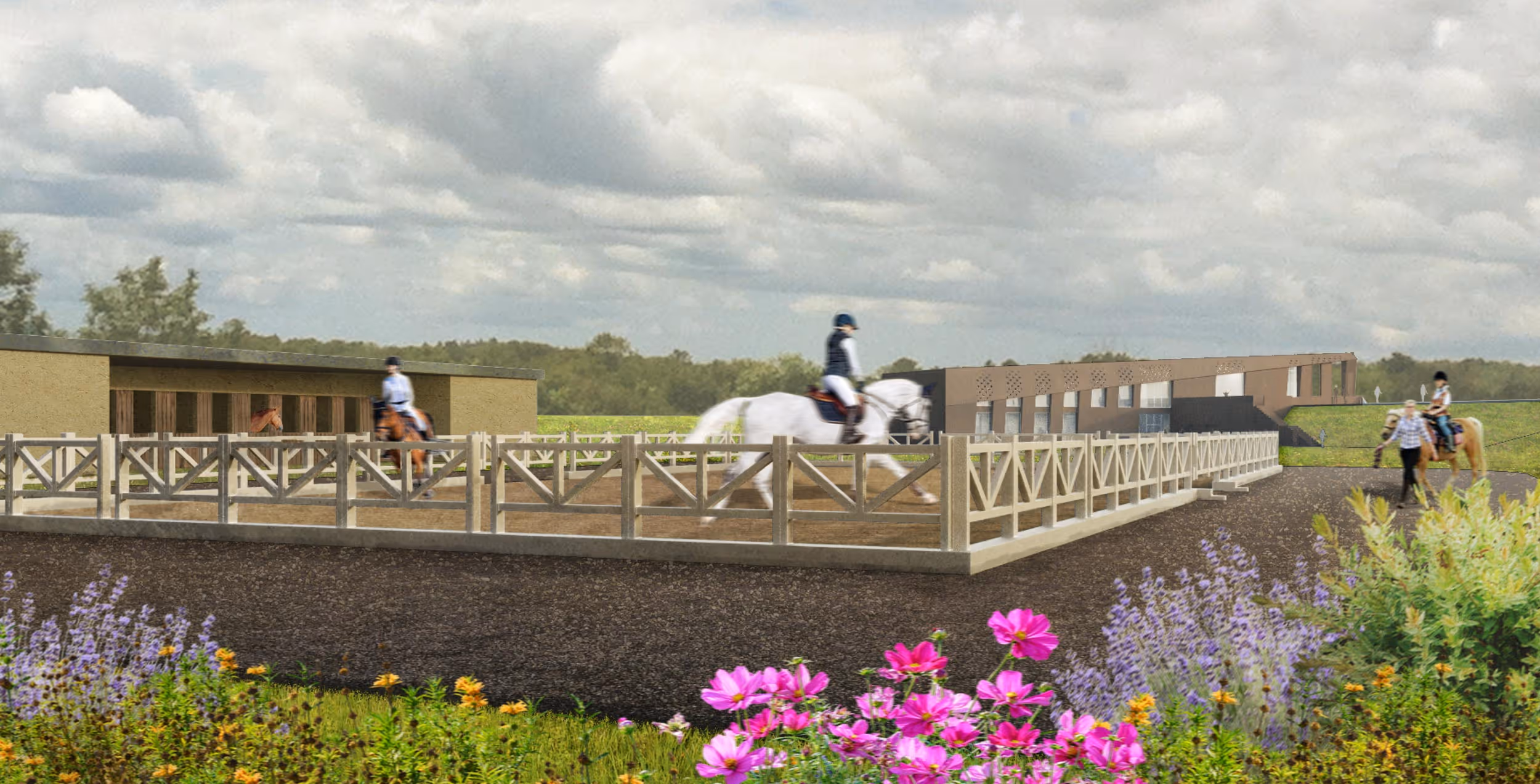 Equestrian center with riders on horses inside a fenced riding arena and a stable building in the background, surrounded by greenery and flowers.