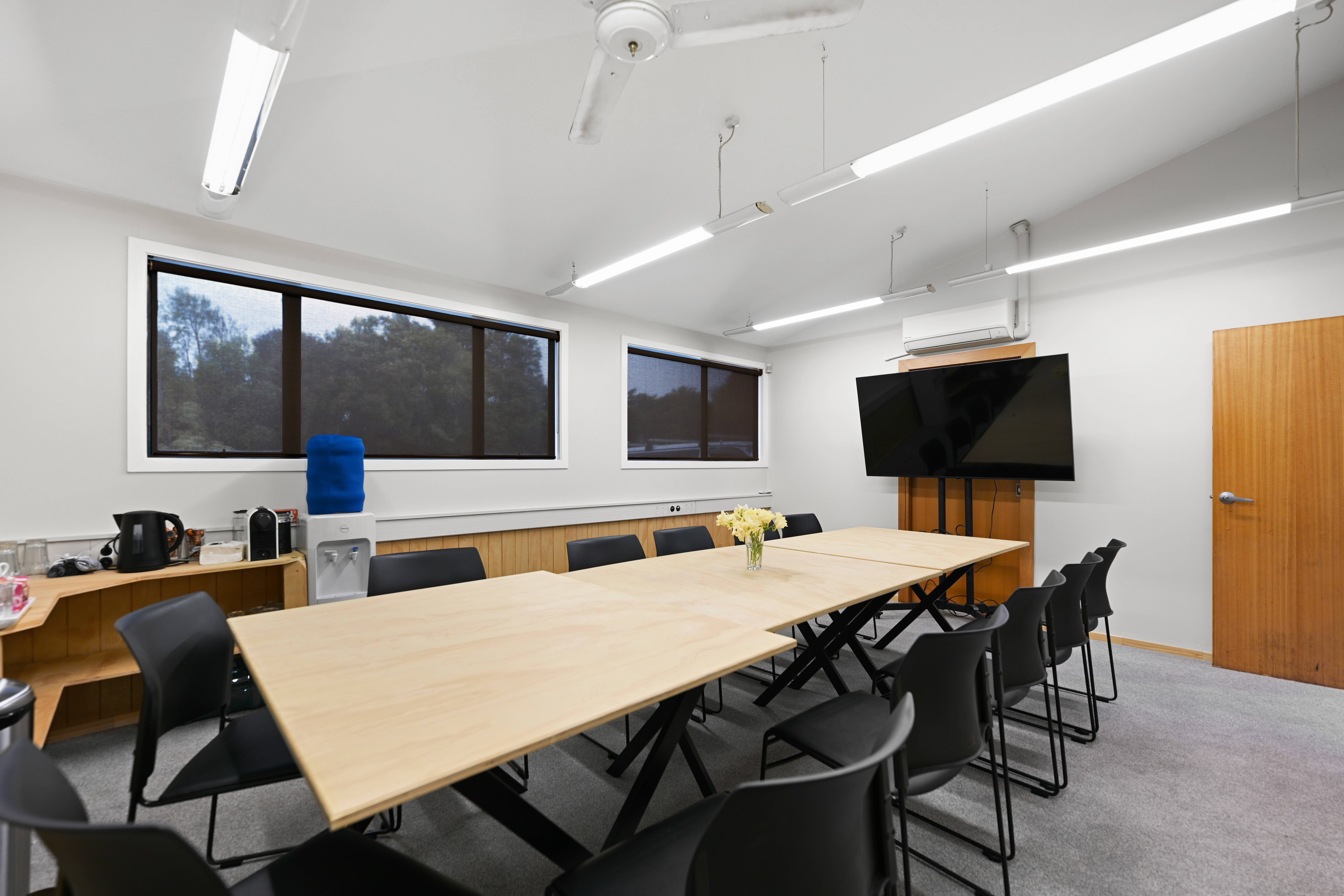 The Boardroom at Padel Park Hamilton - full room view with modular tables and 65 inch TV