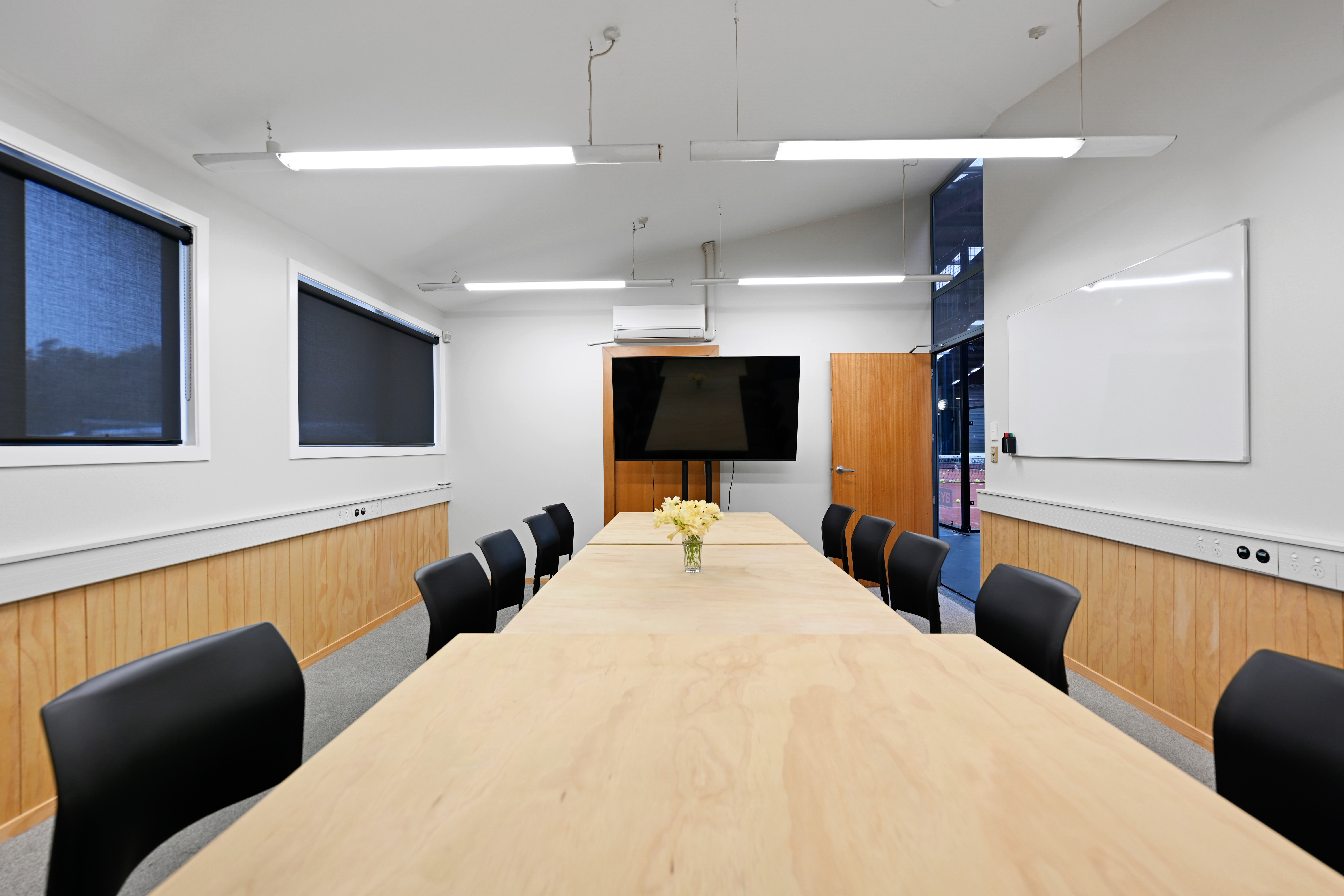 Padel Park Hamilton meeting room - boardroom setup with whiteboard and video conferencing