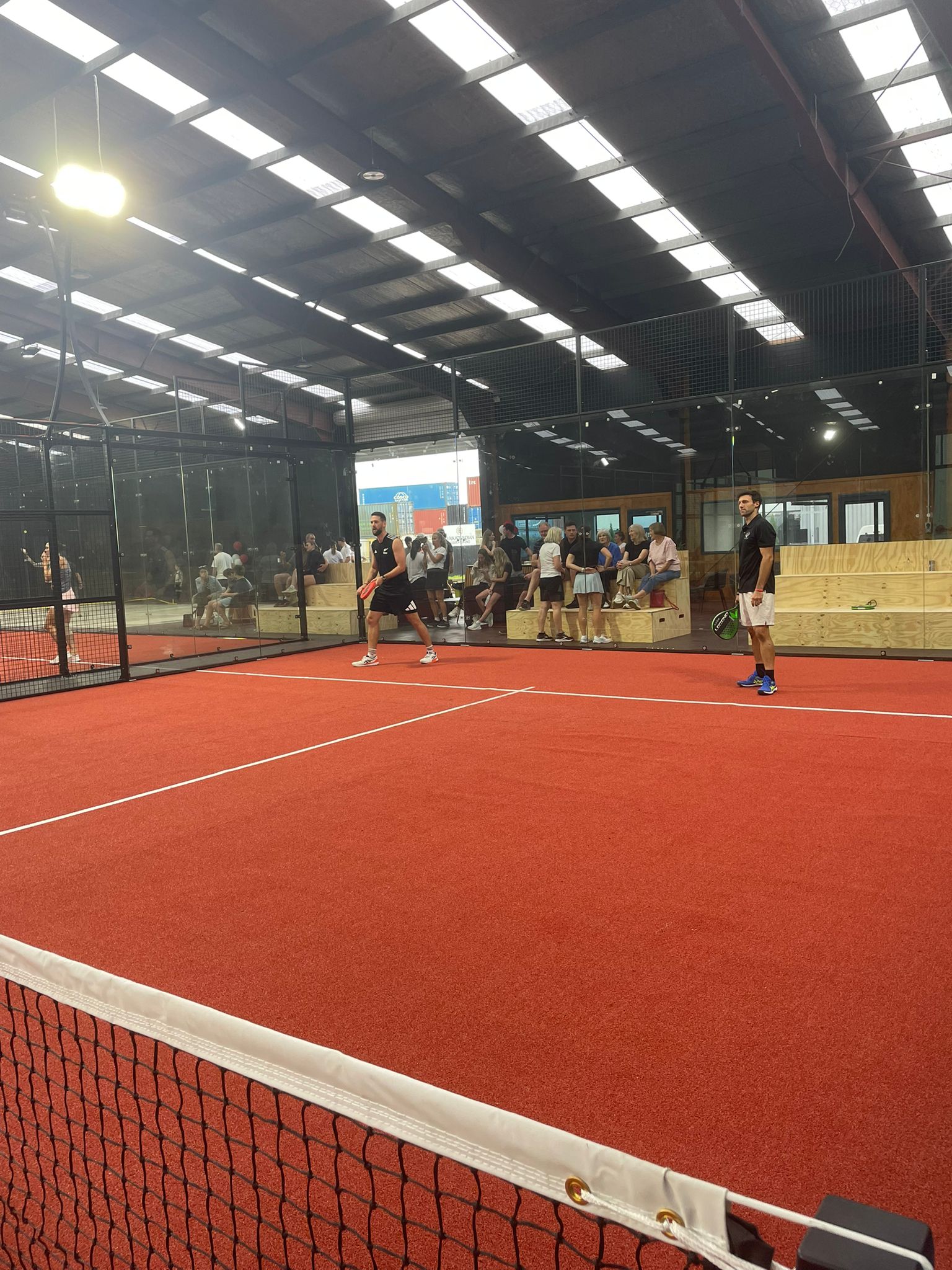 Padel equipment on a green court