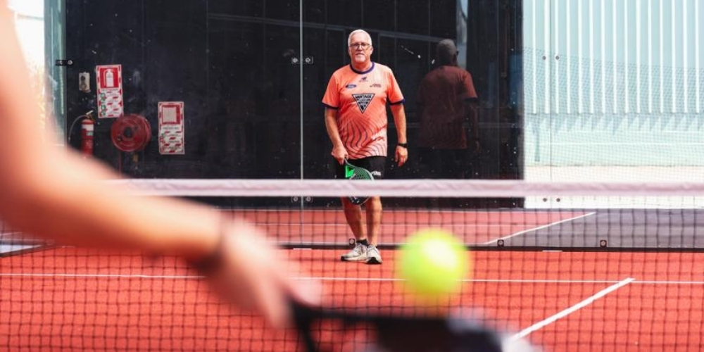 Padel equipment on a green court