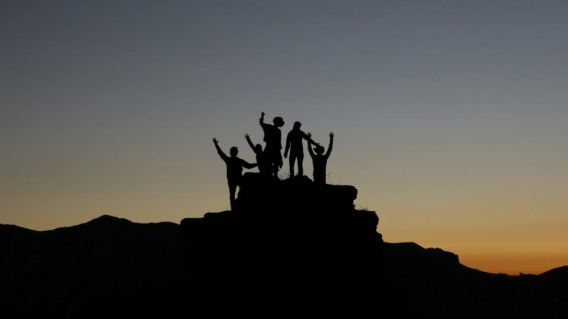 Team at the top of a summit - Photo by Natalie Pedigo on Unsplash