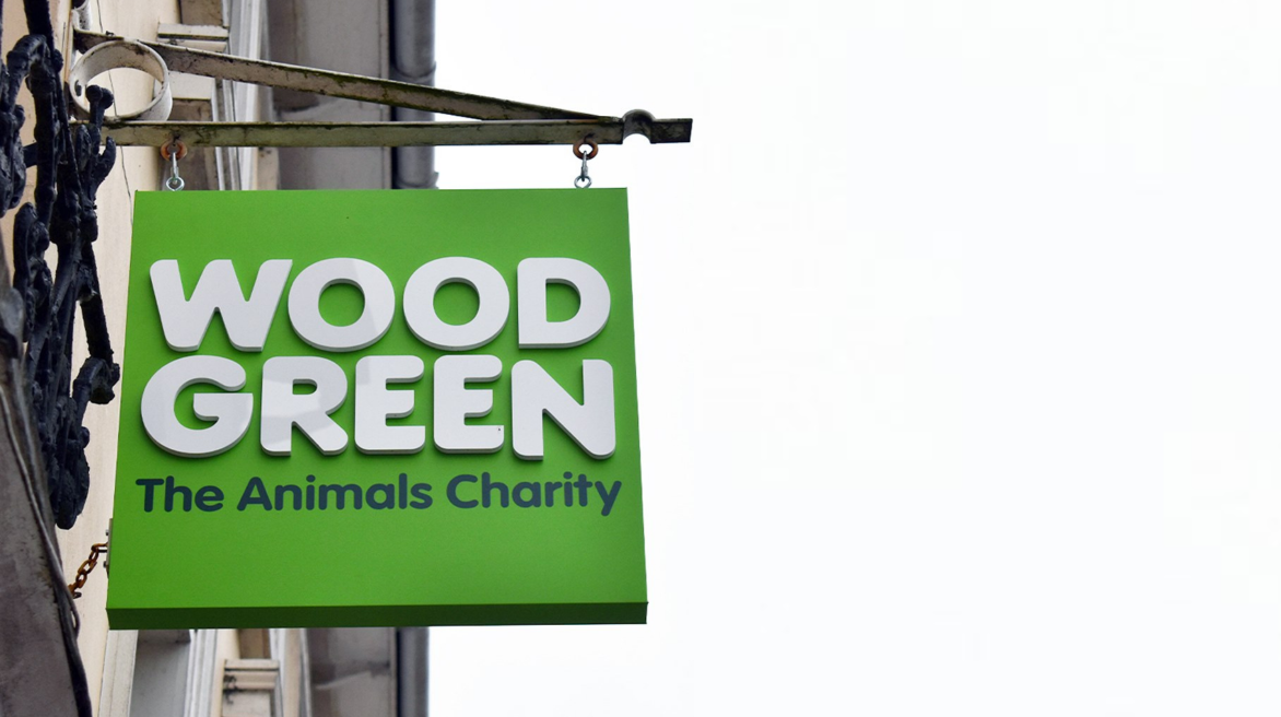 Wood Green sign displayed in a high-traffic area to raise awareness and encourage donations.