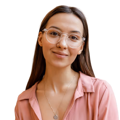 Smiling young woman with long brown hair, clear glasses, and a pink blouse.