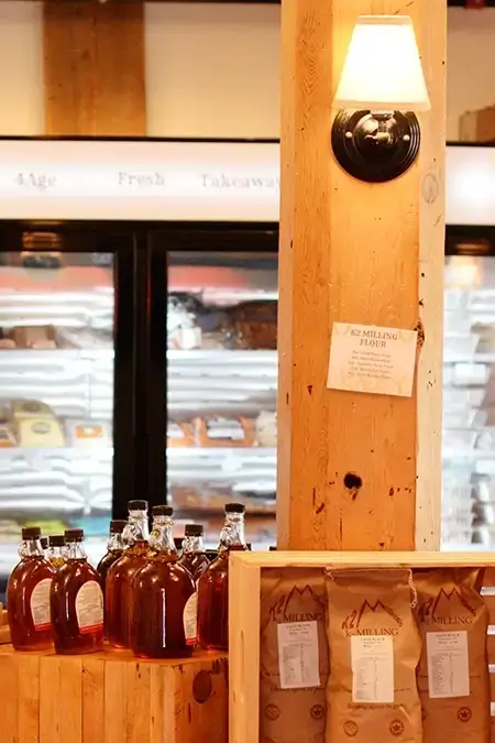 Wood shelving with bottles and bags