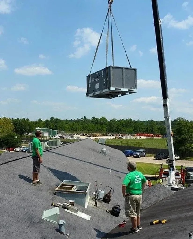 A technician installing an HVAC system in a residential home, illustrating professional service and proper setup