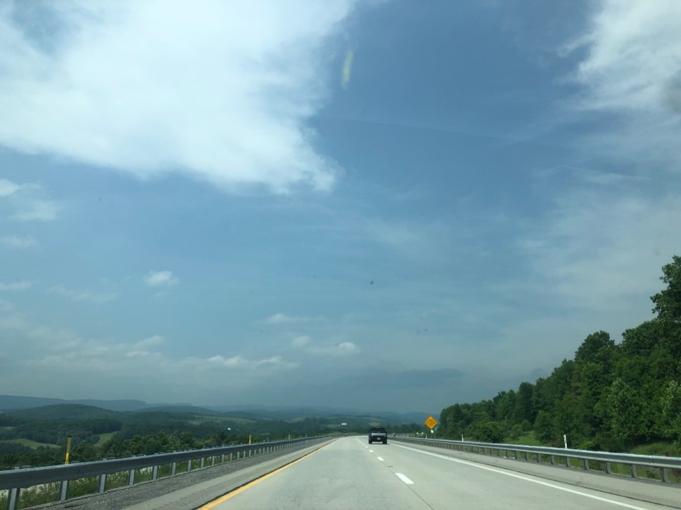 A car driving on a highwayDescription automatically generated with low confidence