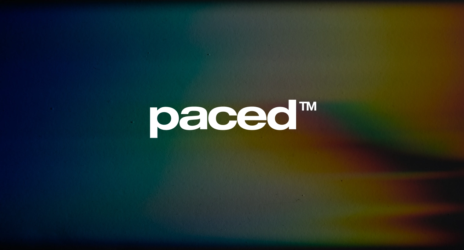 White lowercase text 'paced™' centered on a dark, multicolored gradient background.