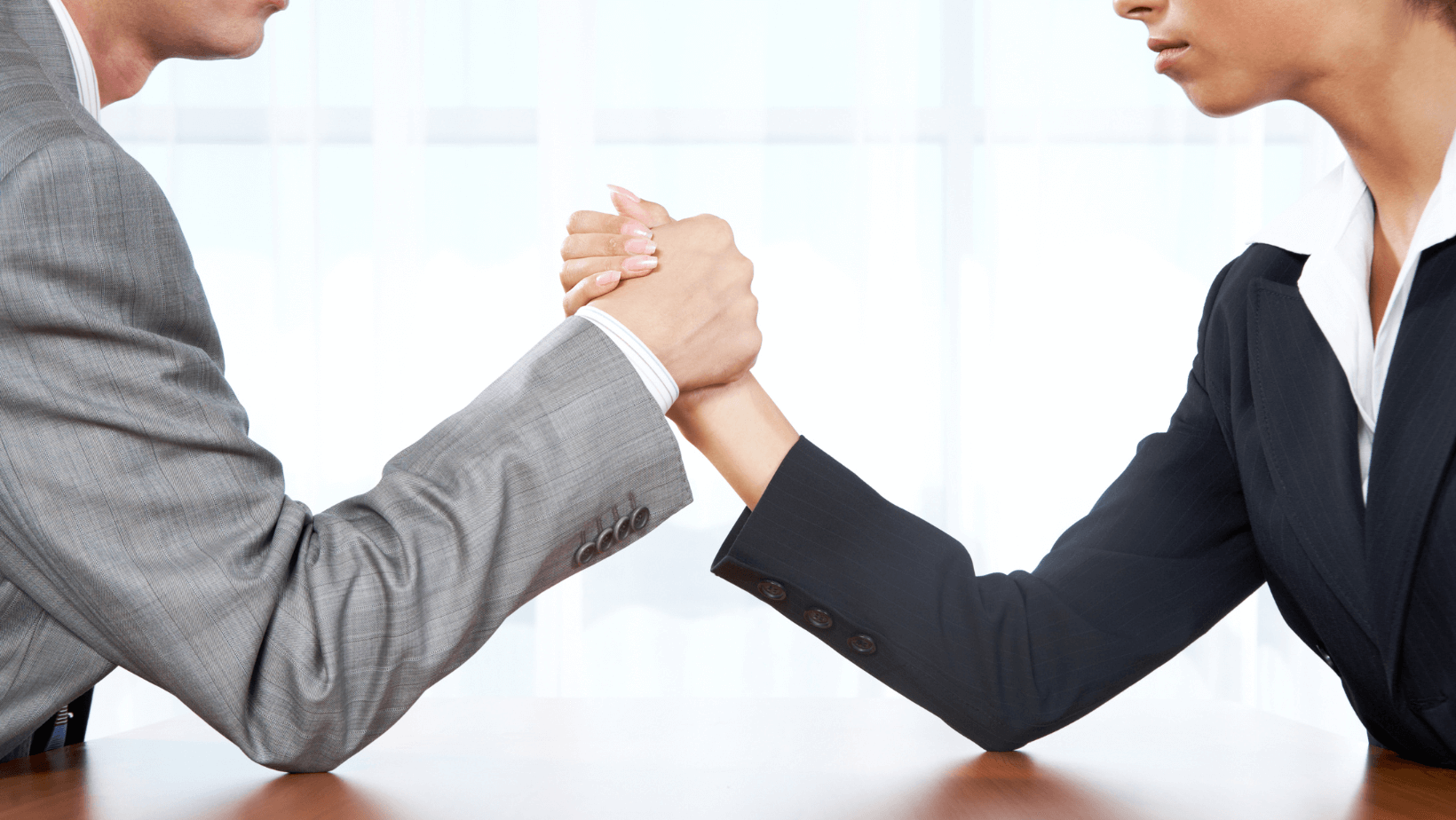 two professionals getting ready to arm wrestle