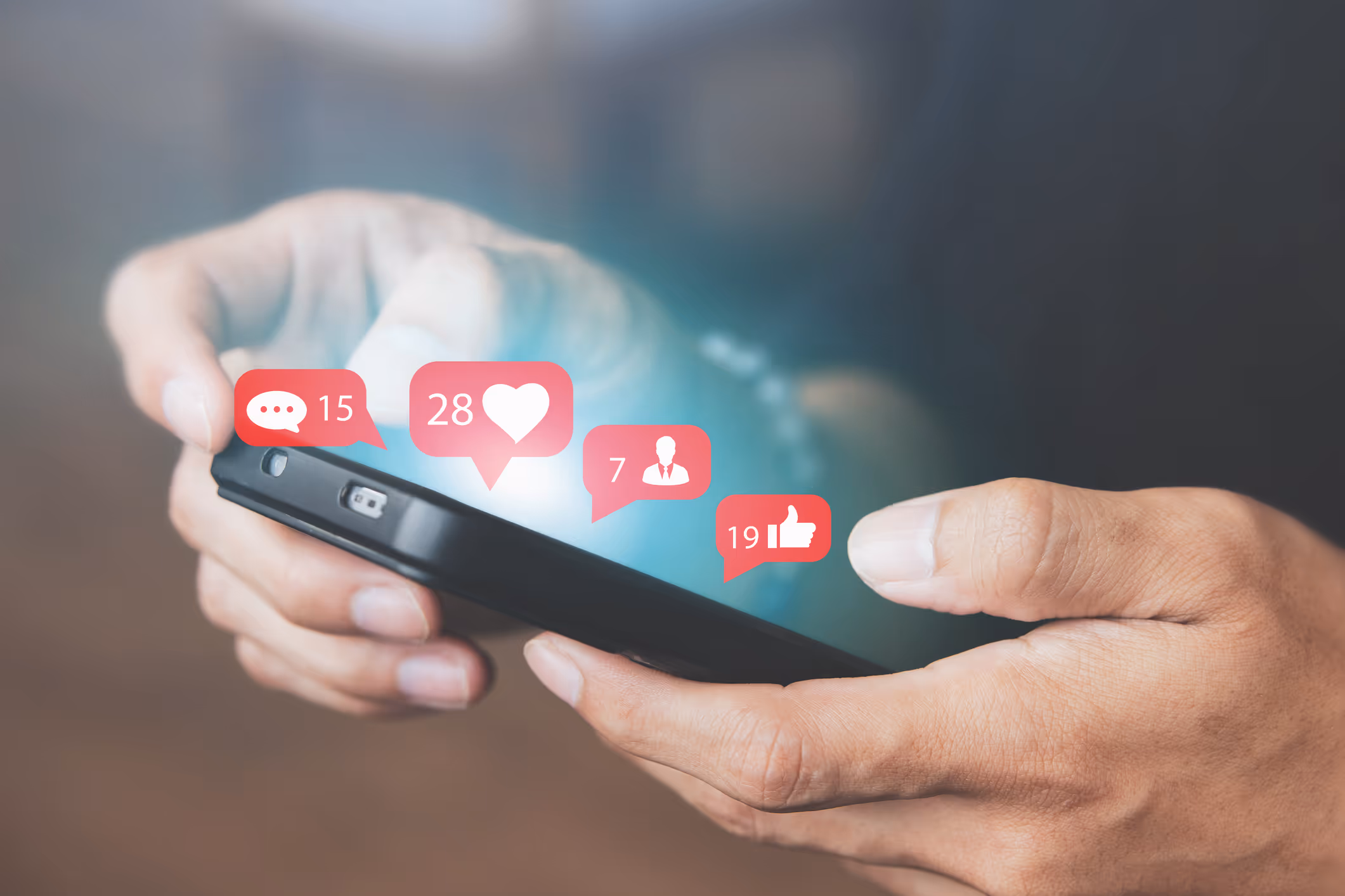 closeup of phone with icons for liking and connecting