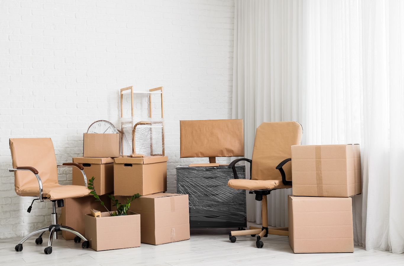 Minute Men Movers crew packing and organizing items during a residential moving company job in Edina with detailed handling and care