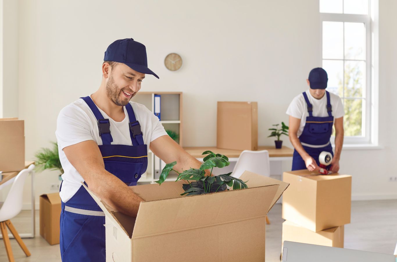 Minute Men Movers staff providing packing services in Minnetonka, MN with organized packing methods and protective materials.