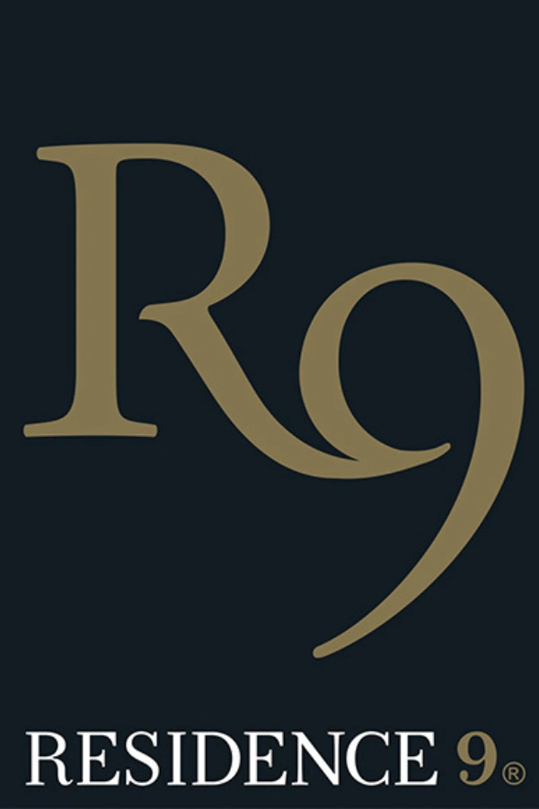 Logo for Residence 9 featuring a stylized 'R9' in gold on a black background with the text 'RESIDENCE 9' below.