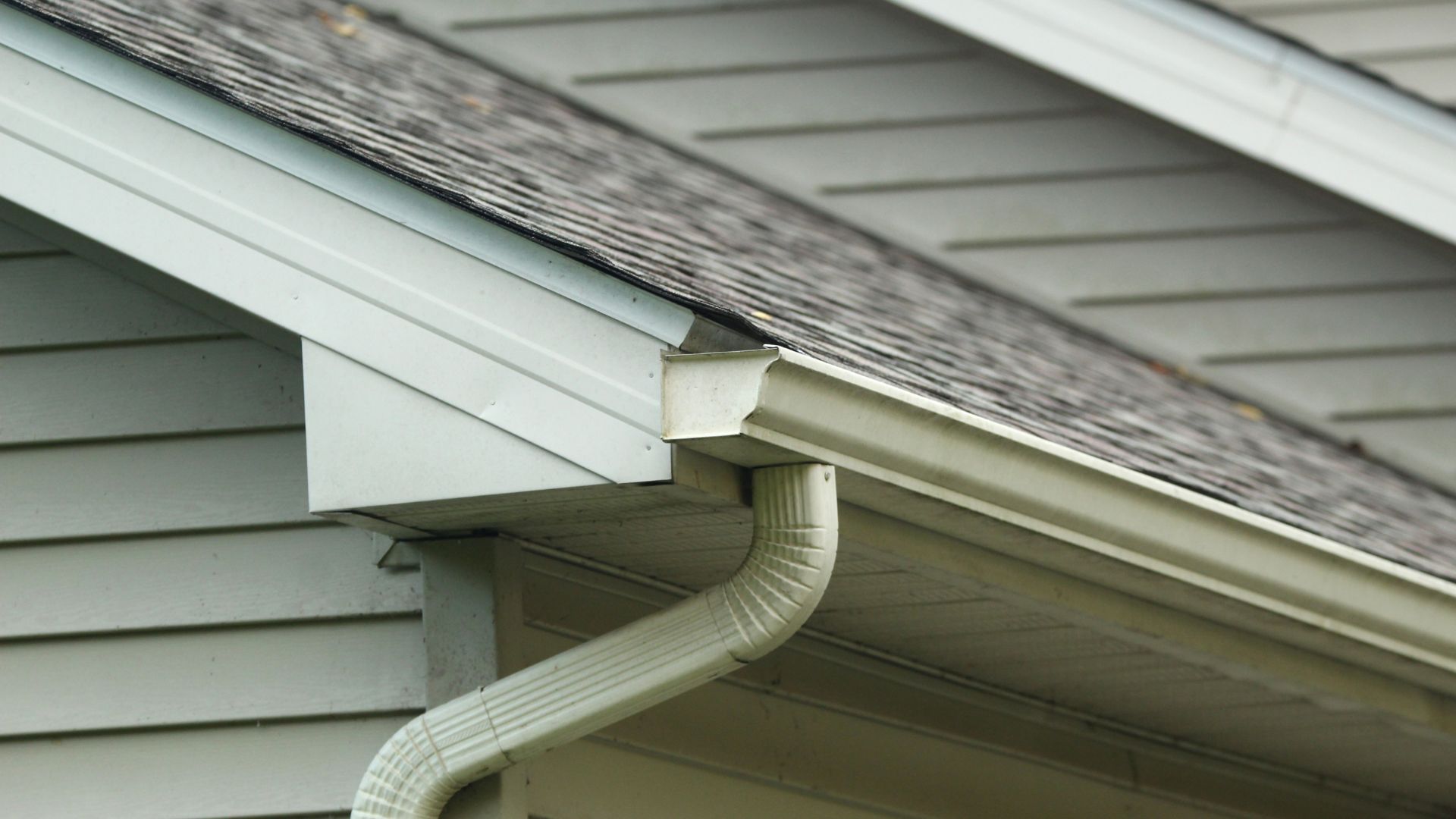 Close-up of a seamless gutter system on a modern home.